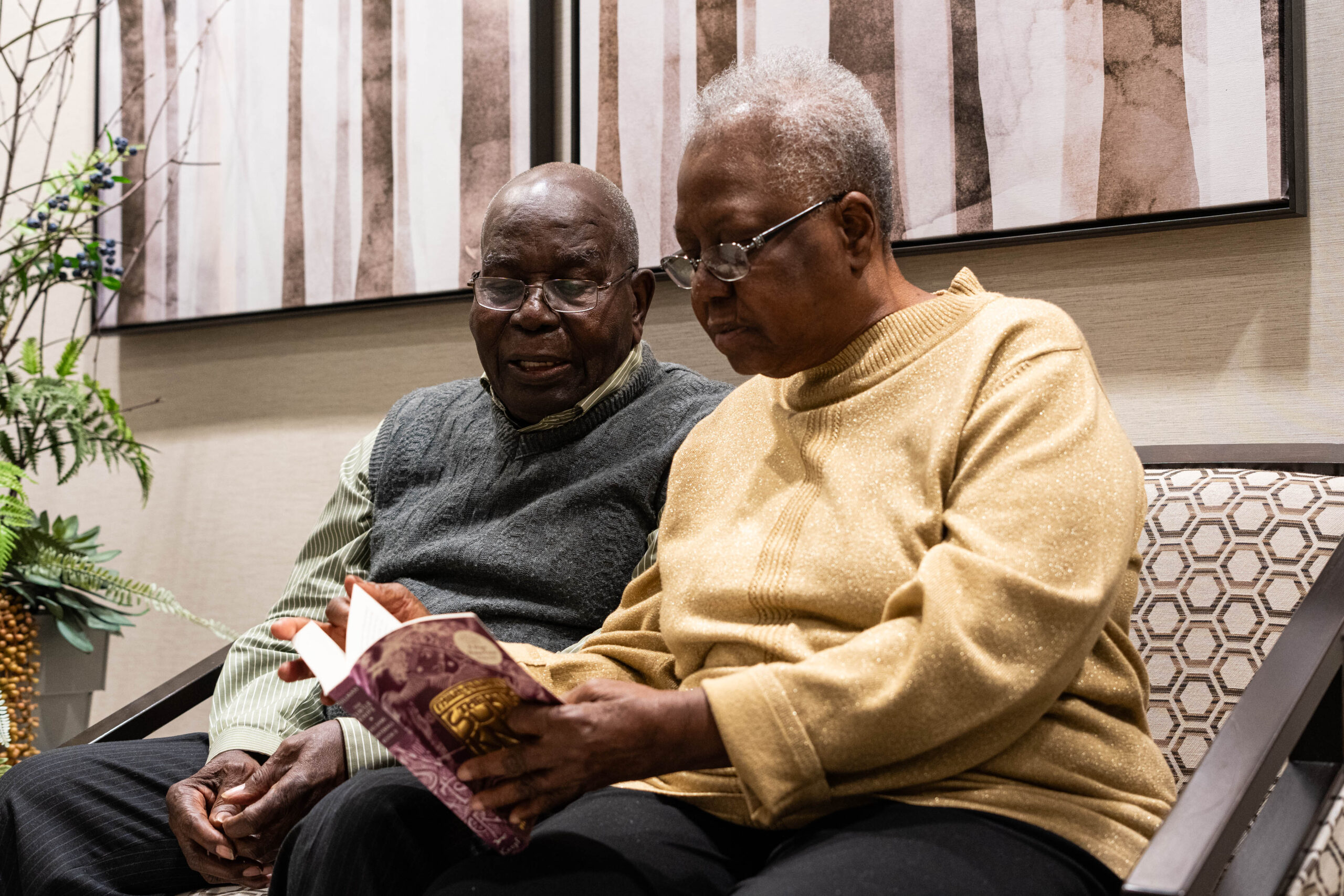 Senior couple reading in a retirement home in Toronto North York